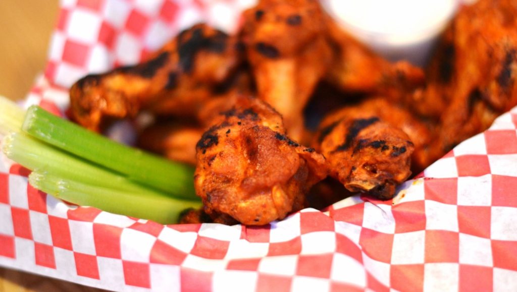 Wings and celery in a red and white checkered basket served at The Dock at Water in Chillicothe, Ohio.