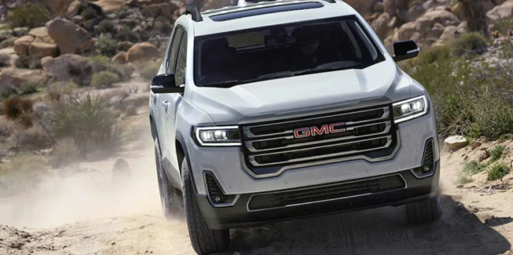 A white 2022 GMC Terrain driving down a mountain.