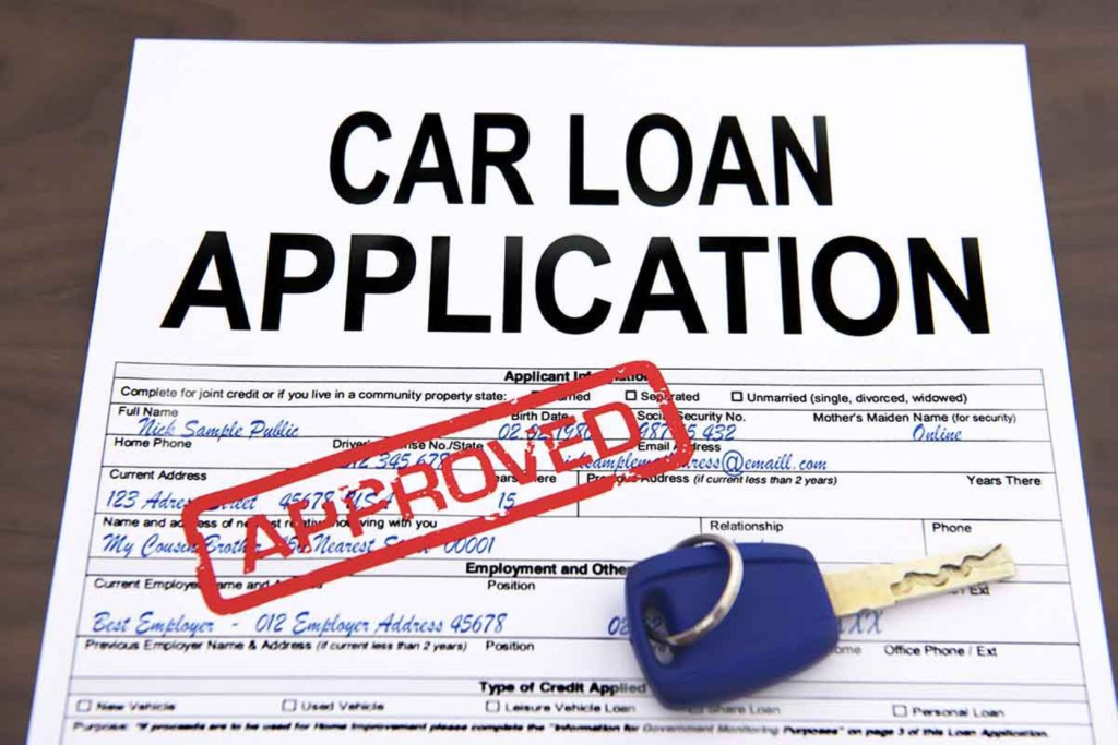 A car loan application with a "Approved" stamp and a car key.